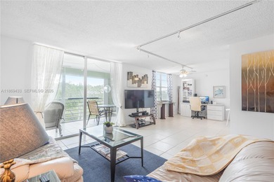 East Boca living just 1 mile from the beach. This bright 1,300