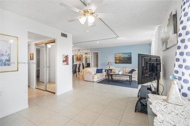 East Boca living just 1 mile from the beach. This bright 1,300