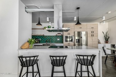 This stunning corner-unit apartment offers high-rise living with