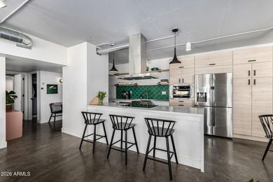 This stunning corner-unit apartment offers high-rise living with