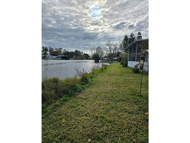 Live on the water ! Lovely screened in porch all year views of - photo 5