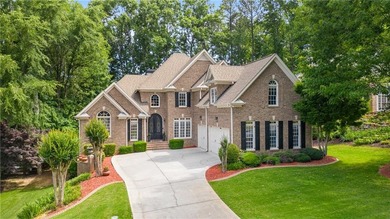 Elegant four-sided brick home with a luxurious primary suite on - photo 1