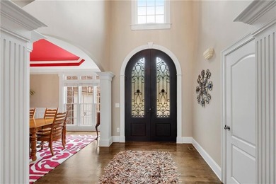 Elegant four-sided brick home with a luxurious primary suite on - photo 4