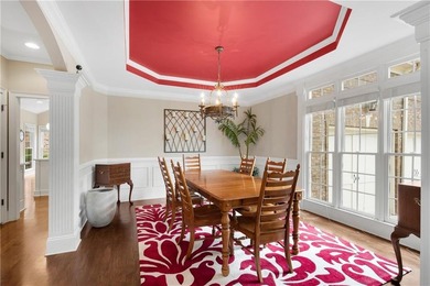 Elegant four-sided brick home with a luxurious primary suite on - photo 5