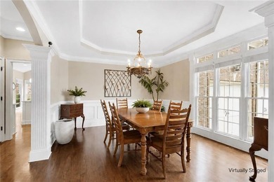 Elegant four-sided brick home with a luxurious primary suite on - photo 6