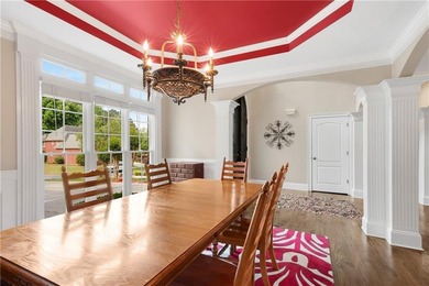 Elegant four-sided brick home with a luxurious primary suite on - photo 7