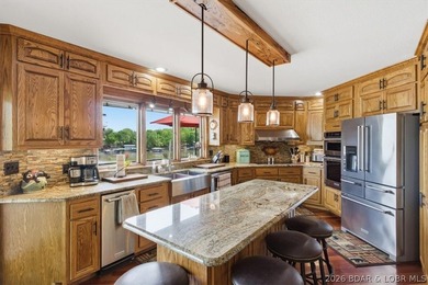 Vaulted ceilings, walls of windows, and wood-burning fireplace - photo 13