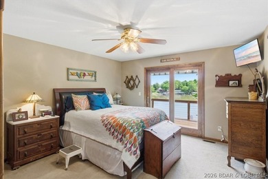 Vaulted ceilings, walls of windows, and wood-burning fireplace - photo 18
