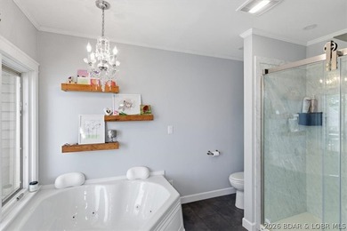 Vaulted ceilings, walls of windows, and wood-burning fireplace - photo 21
