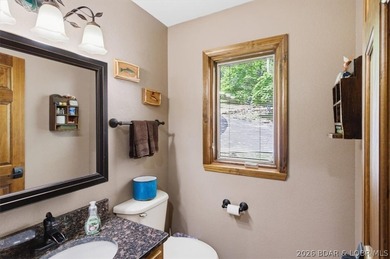 Vaulted ceilings, walls of windows, and wood-burning fireplace - photo 22