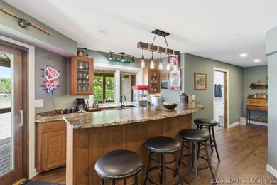 Vaulted ceilings, walls of windows, and wood-burning fireplace - photo 26