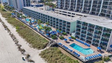 Wake up to the sound of waves and endless ocean views from this