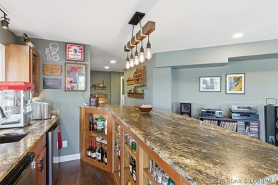 Vaulted ceilings, walls of windows, and wood-burning fireplace - photo 27
