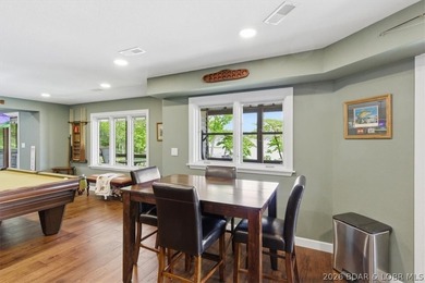 Vaulted ceilings, walls of windows, and wood-burning fireplace - photo 28