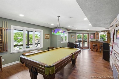 Vaulted ceilings, walls of windows, and wood-burning fireplace - photo 29
