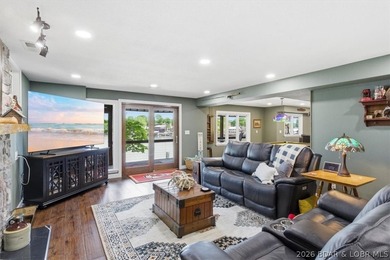 Vaulted ceilings, walls of windows, and wood-burning fireplace - photo 31