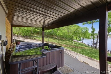 Vaulted ceilings, walls of windows, and wood-burning fireplace - photo 39