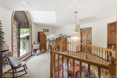 Vaulted ceilings, walls of windows, and wood-burning fireplace - photo 40