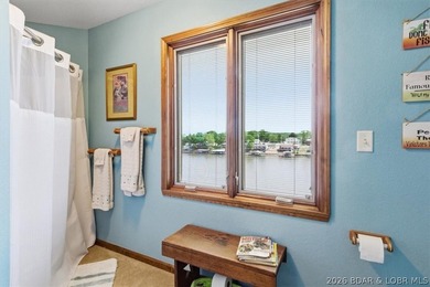 Vaulted ceilings, walls of windows, and wood-burning fireplace - photo 43