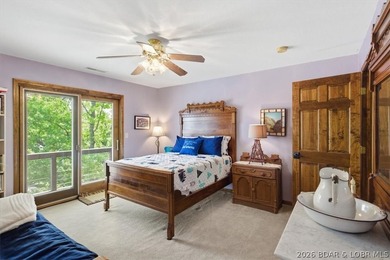 Vaulted ceilings, walls of windows, and wood-burning fireplace - photo 45