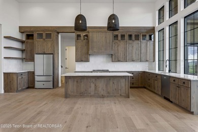 This custom home in Teton Reserve offers a unique plan with - photo 11