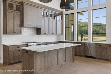 This custom home in Teton Reserve offers a unique plan with - photo 14