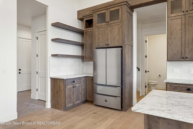 This custom home in Teton Reserve offers a unique plan with - photo 15