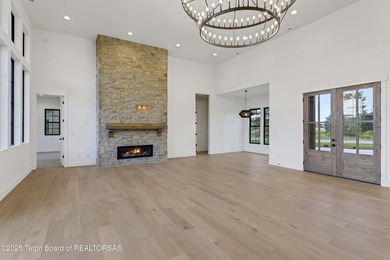 This custom home in Teton Reserve offers a unique plan with - photo 16