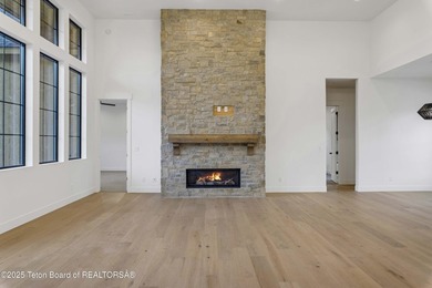 This custom home in Teton Reserve offers a unique plan with - photo 17