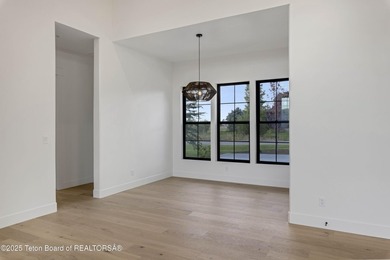 This custom home in Teton Reserve offers a unique plan with - photo 18