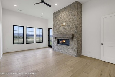 This custom home in Teton Reserve offers a unique plan with - photo 19