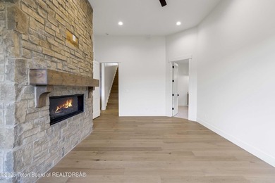 This custom home in Teton Reserve offers a unique plan with - photo 20