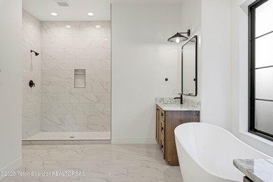 This custom home in Teton Reserve offers a unique plan with - photo 22