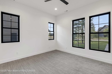 This custom home in Teton Reserve offers a unique plan with - photo 23