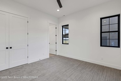 This custom home in Teton Reserve offers a unique plan with - photo 24