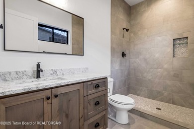 This custom home in Teton Reserve offers a unique plan with - photo 25