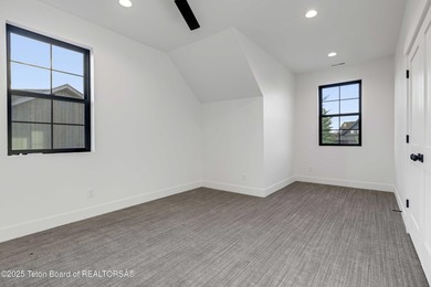 This custom home in Teton Reserve offers a unique plan with - photo 26