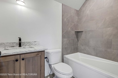 This custom home in Teton Reserve offers a unique plan with - photo 27