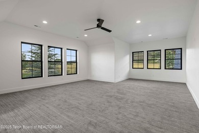 This custom home in Teton Reserve offers a unique plan with - photo 29