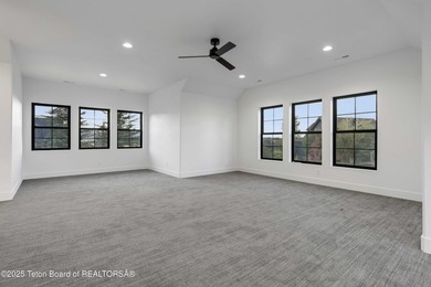 This custom home in Teton Reserve offers a unique plan with - photo 30