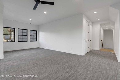 This custom home in Teton Reserve offers a unique plan with - photo 31