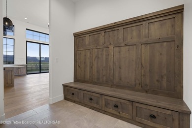 This custom home in Teton Reserve offers a unique plan with - photo 33