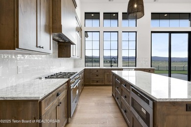 This custom home in Teton Reserve offers a unique plan with - photo 34