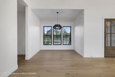 This custom home in Teton Reserve offers a unique plan with - photo 35