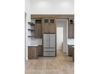 This custom home in Teton Reserve offers a unique plan with - photo 36