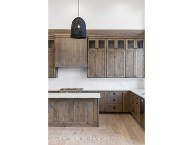 This custom home in Teton Reserve offers a unique plan with - photo 37