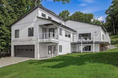 This contemporary home is on a half acre lot surrounded by - photo 1