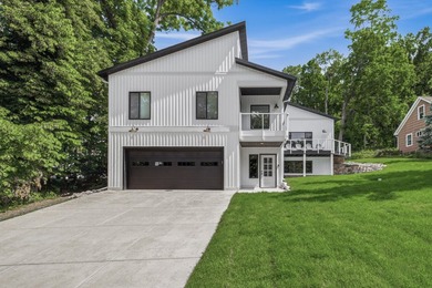 This contemporary home is on a half acre lot surrounded by - photo 2