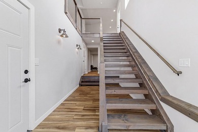 This contemporary home is on a half acre lot surrounded by - photo 4