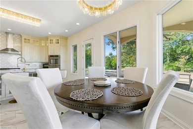 Welcome to this exquisite Spanish-style waterfront estate which